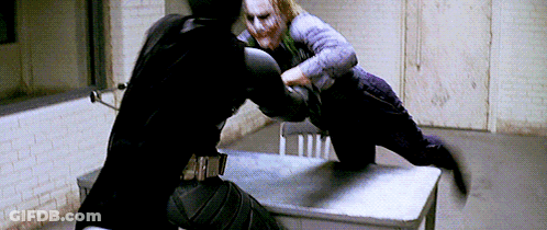Man In Black Suit Fighting Man In Purple Suit GIF