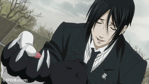 Man In Black Suit Holding Black Cat GIF