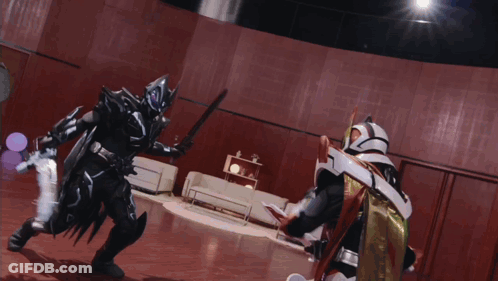 Man In Black Suit Holding Sword GIF