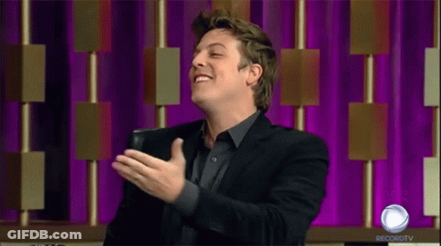 Man In Black Suit Laughing GIF