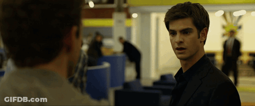 Man In Black Suit Looking At Another Man GIF