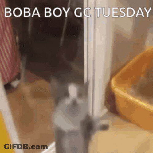 Man In Black Suit Looking Out Window GIF