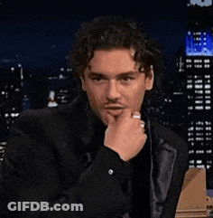 Man In Black Suit Smiling At Computer GIF