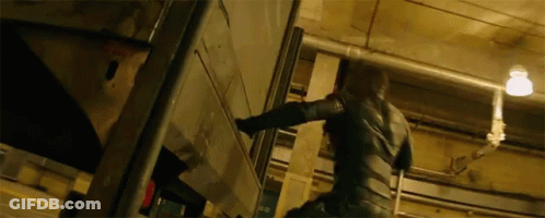 Man In Black Suit Standing GIF