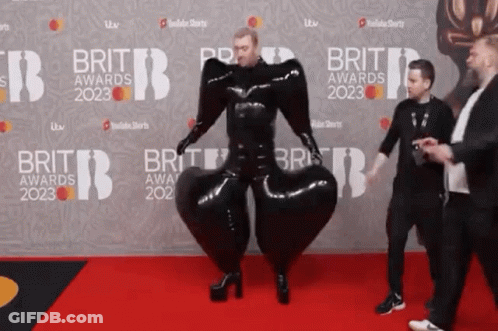Man In Black Suit Walking On Brit Awards 2023 Red Carpet GIF