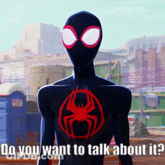 Man In Black Suit With Red Spider Says Do You Want To Talk GIF