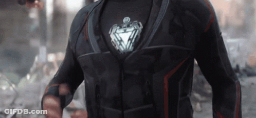 Man In Black Suit With Silver Heart GIF