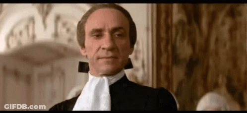 Man In Black Suit With White Lapel Tie GIF