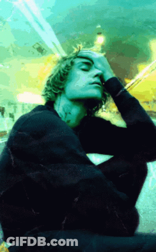 Man In Black Sweater Hand To Face GIF
