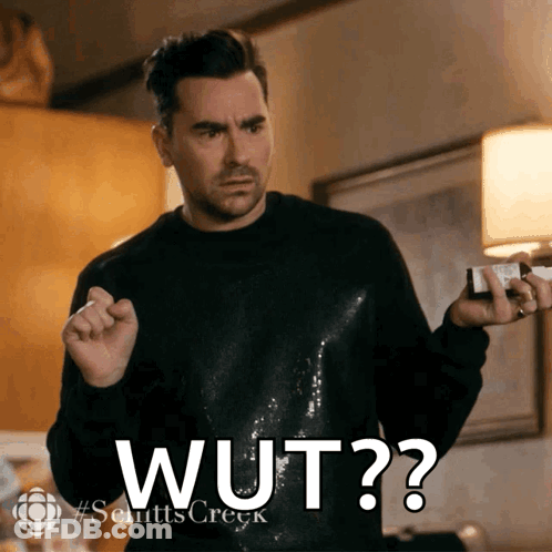 Man In Black Sweater Holding Bottle Saying Wut GIF
