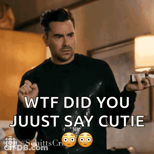 Man In Black Sweater Holding Bottle Says WTF Did You Just Say Cutie GIF