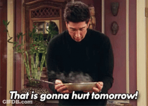 Man In Black Sweater Holding Bowl Saying That Is Gonna Hurt Tomorrow GIF