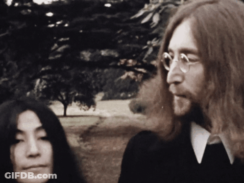 Man In Black Sweater Holding Plate GIF