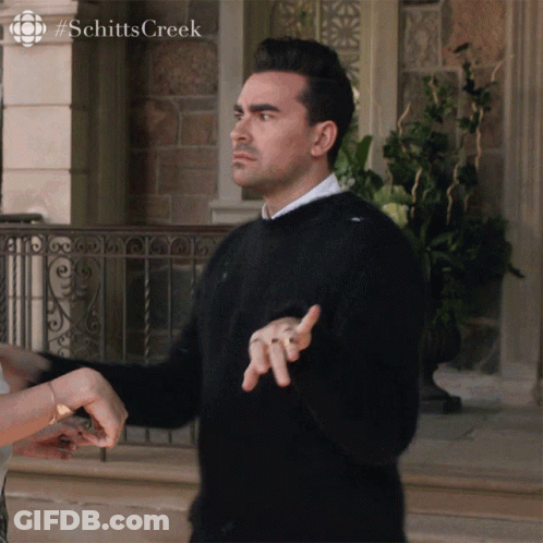 Man In Black Sweater In Front Of Building #Schitts Creek GIF