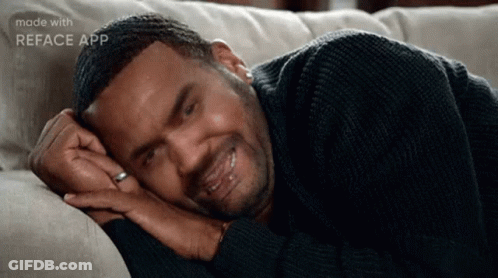 Man In Black Sweater Lying On Couch GIF