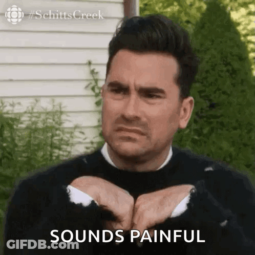 Man In Black Sweater Making Funny Face Says Sounds Painful GIF