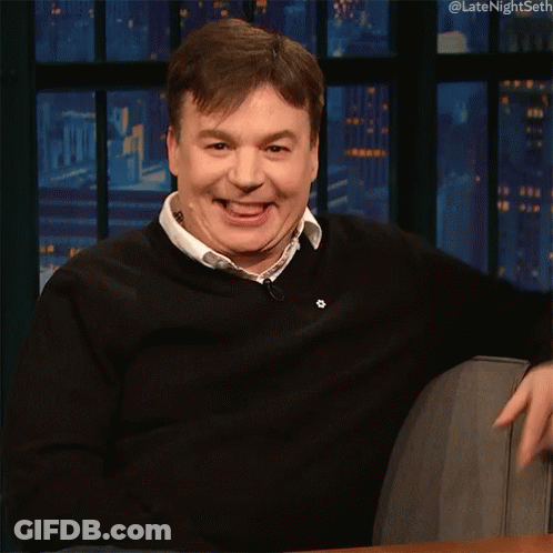Man In Black Sweater Smiling And Pointing GIF