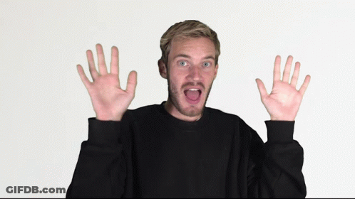 Man In Black Sweater With Funny Face And Hands Raised GIF