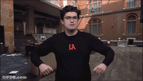 Man In Black Sweater With Ia Letter GIF