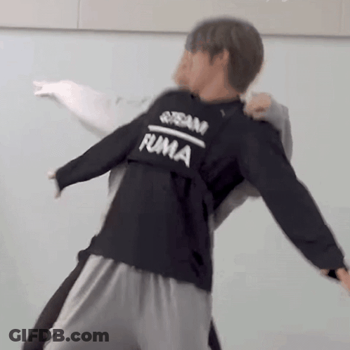 Man In Black Sweatshirt Holding Man In Grey Sweatshirt GIF