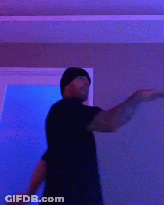 Man In Black T-Shirt And Beanie Making Funny Face GIF