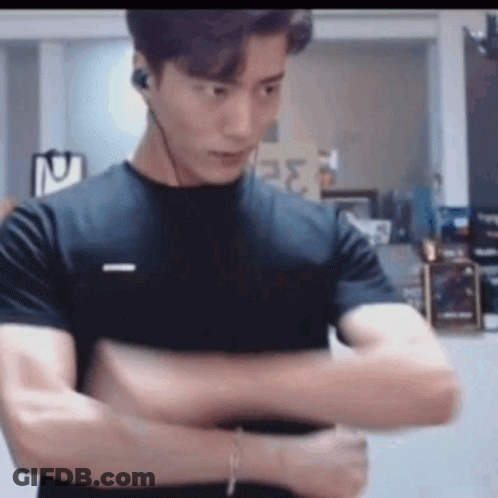 Man In Black T-Shirt And Headphones With Arms Crossed GIF