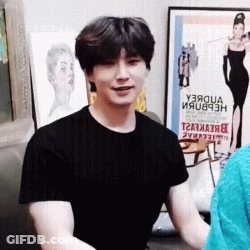 Man In Black T-Shirt In Front Of Y3aqua Poster GIF