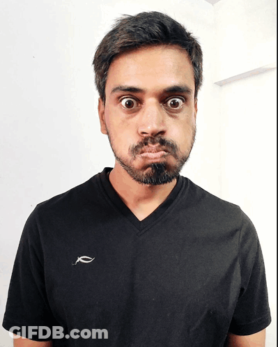 Man In Black T-Shirt Making A Face GIF