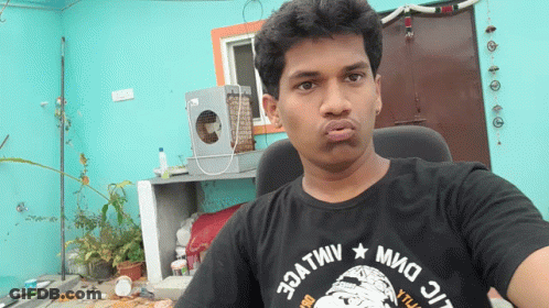 Man In Black T-Shirt Making Funny Face GIF