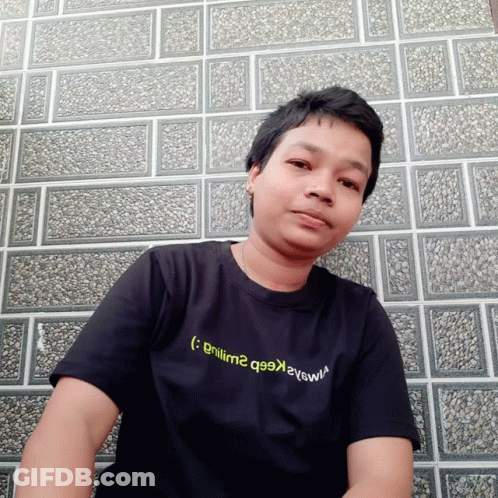Man In Black T-Shirt Saying Gnilm2 GIF