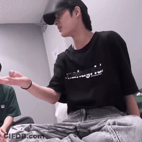 Man In Black T-Shirt Sitting GIF