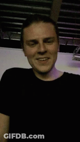 Man In Black T-Shirt Smiling GIF