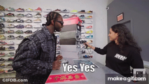 Man In Black Talking To Woman With Yes Yes Shirt GIF