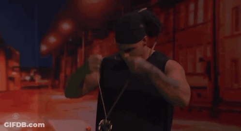 Man In Black Tank Top Adjusting Hat GIF