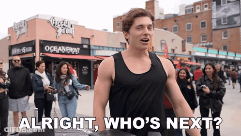Man In Black Tank Top At Oceanfront Building GIF