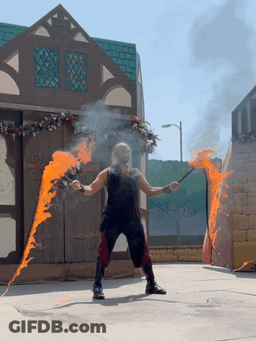 Man In Black Tank Top Holding Fire Stick GIF