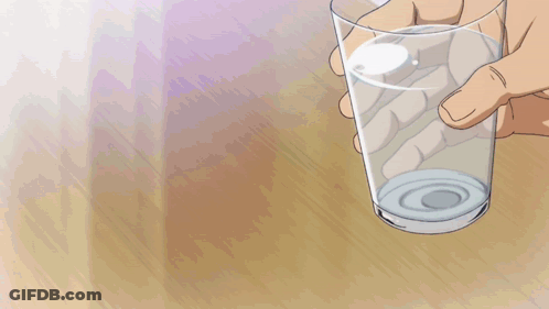 Man In Black Tank Top Holding Glass GIF
