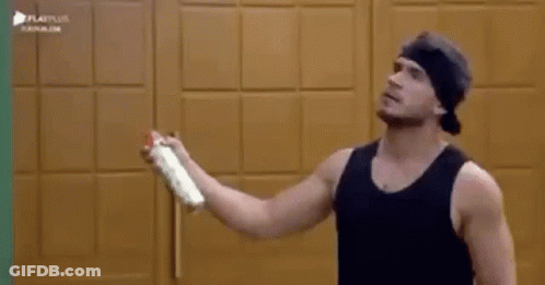Man In Black Tank Top Holding Spray Can GIF
