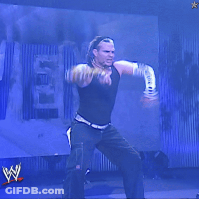 Man In Black Tank Top In Front Of Blue Wall With W Logo GIF