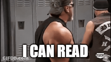 Man In Black Tank Top Reading GIF