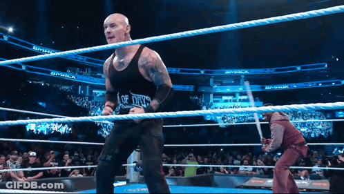 Man In Black Tank Top Saying Of Days In Wrestling Ring GIF