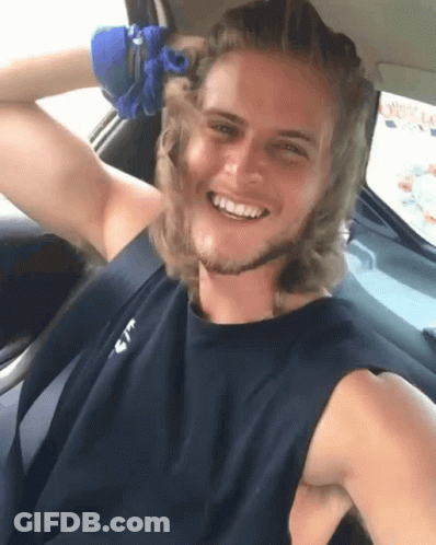 Man In Black Tank Top With Letter T Smiling In Car GIF