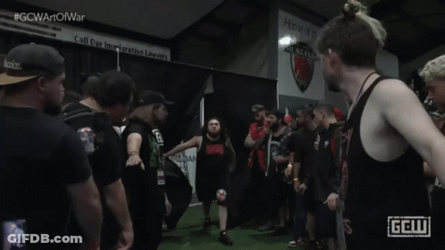 Man In Black Tank Top With Red GCW Logo GIF
