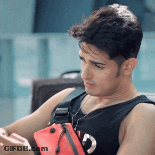 Man In Black Tank Top With Red Supreme Bag GIF