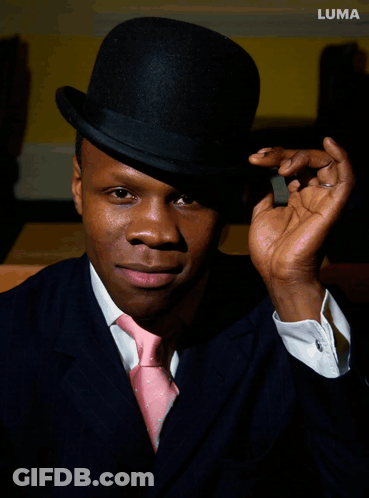 Man In Black Top Hat And Pink Tie With Luma GIF