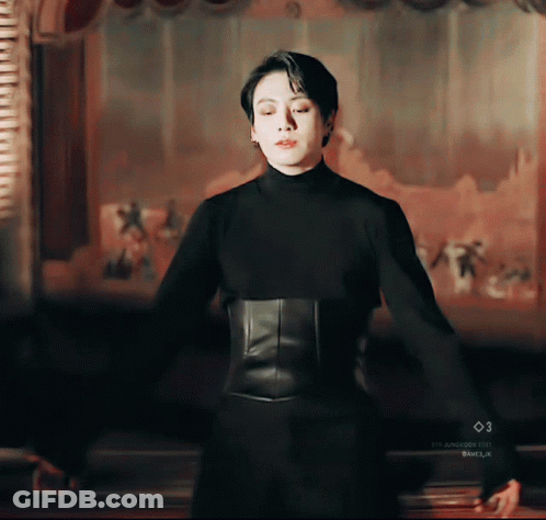 Man In Black Turtleneck And Corset GIF