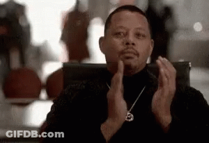 Man In Black Turtleneck Clapping In Chair GIF