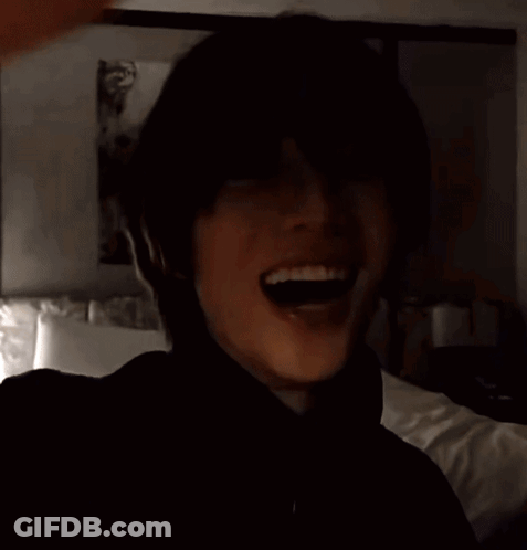 Man In Black Turtleneck In Front Of Bed GIF