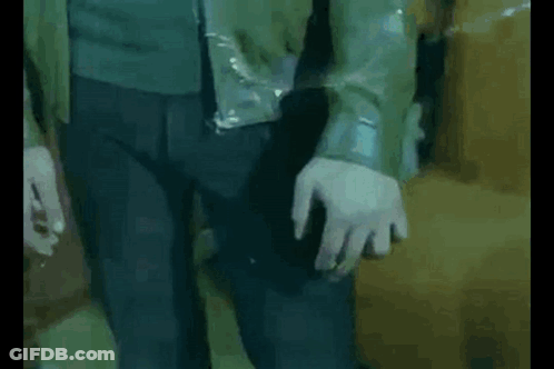 Man In Black Turtleneck Looking At Camera GIF