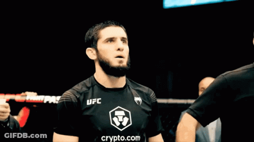 Man In Black UFC Shirt Holding Arm Up GIF